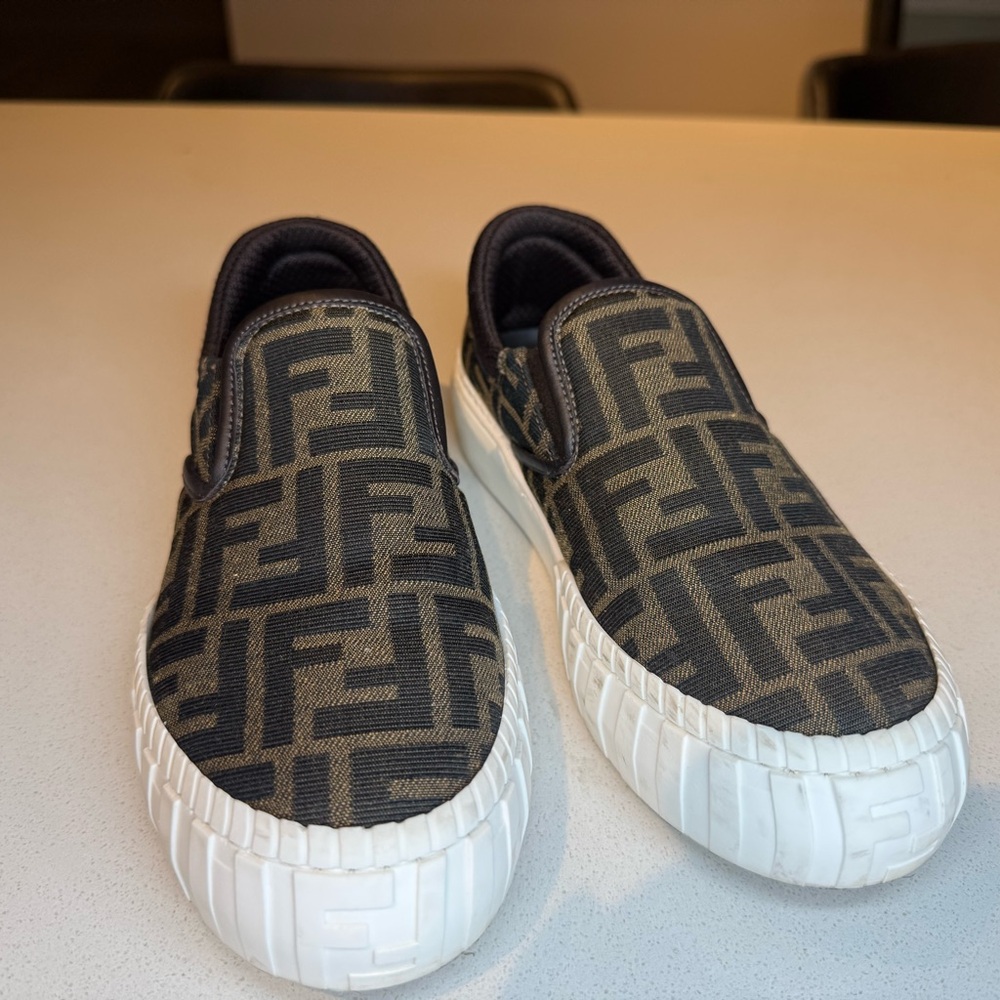 Fendi Monogram Canvas Slip-Ons in Black and Tan